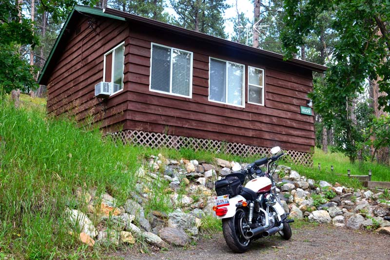 Hugo Cabin exterior with motorcycle