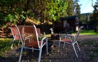 Miners Cabin exterior fire pit and chairs