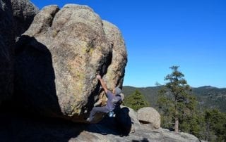 person rock climbing badlands