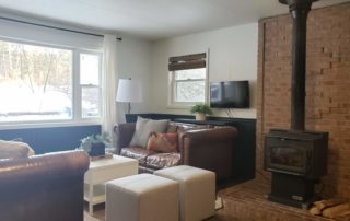 Golden Slipper Cabin living room and wood stove